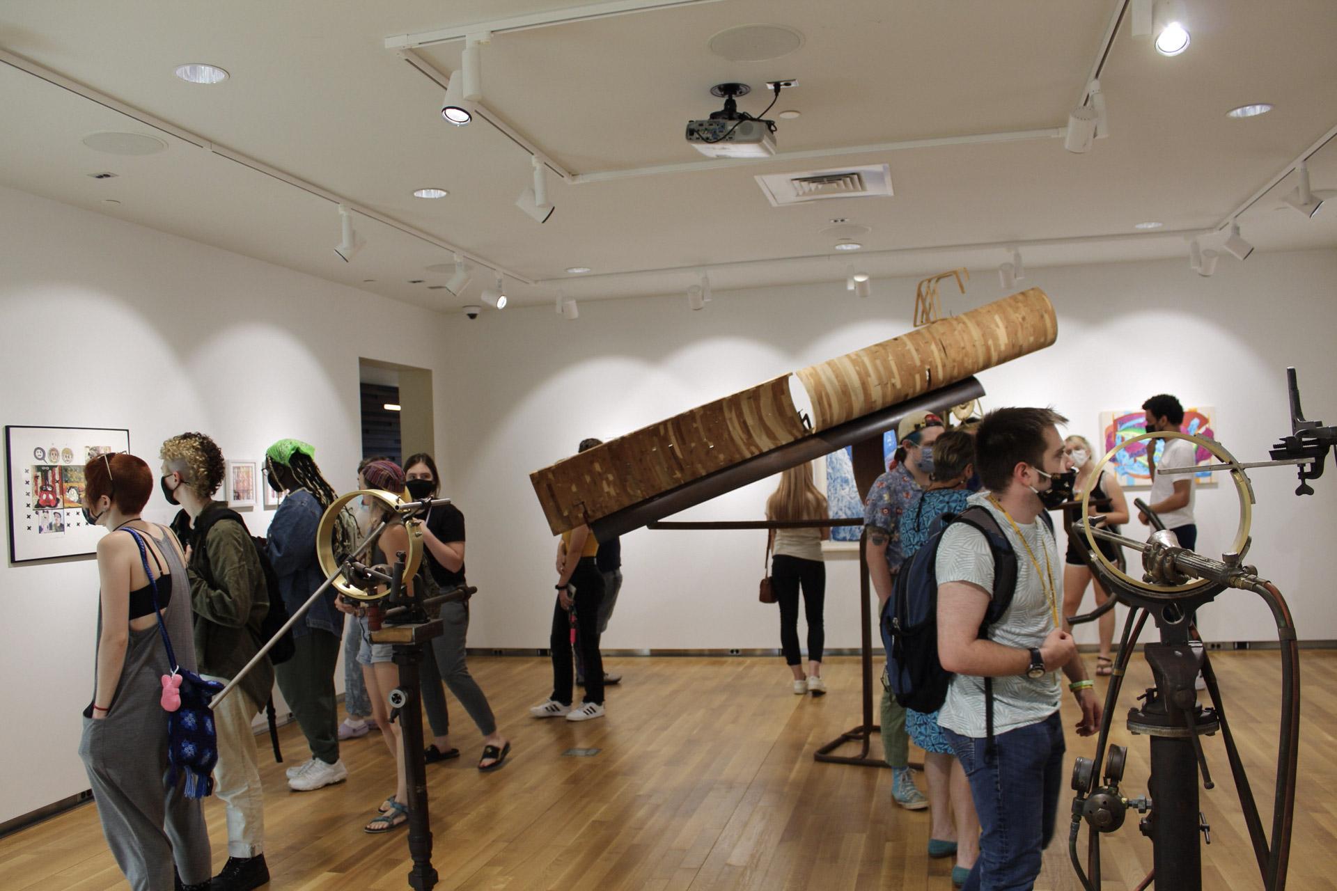 Students view art in the Poole Art Gallery.